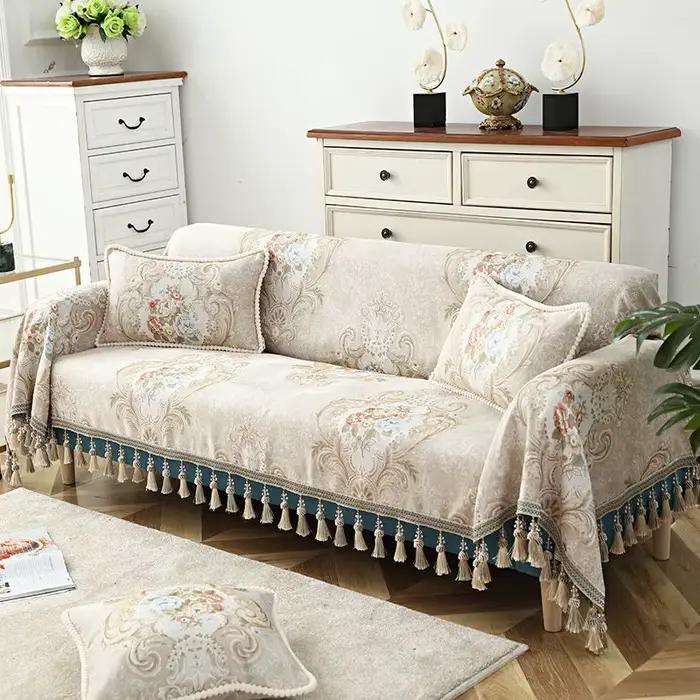 Couverture de canapé en coton avec pompon