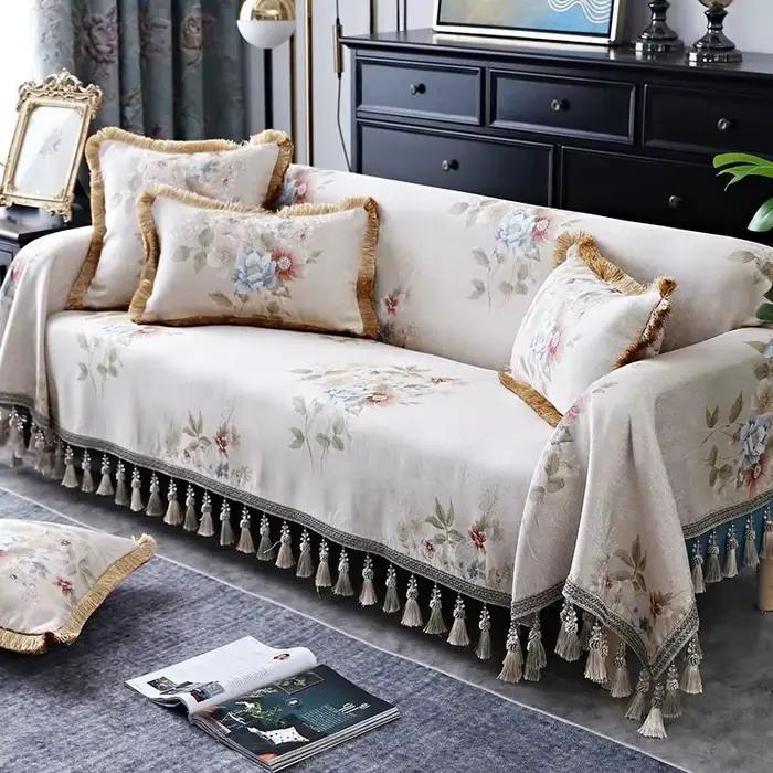 Couverture de canapé en coton avec pompon