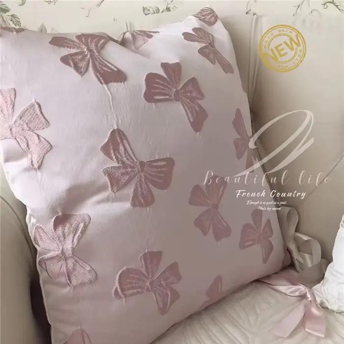 Taie d'oreiller Jacquard avec nœud rose