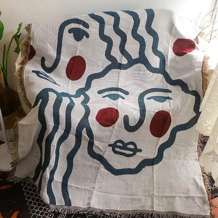 Textile City Couverture à pampilles avec visage abstrait