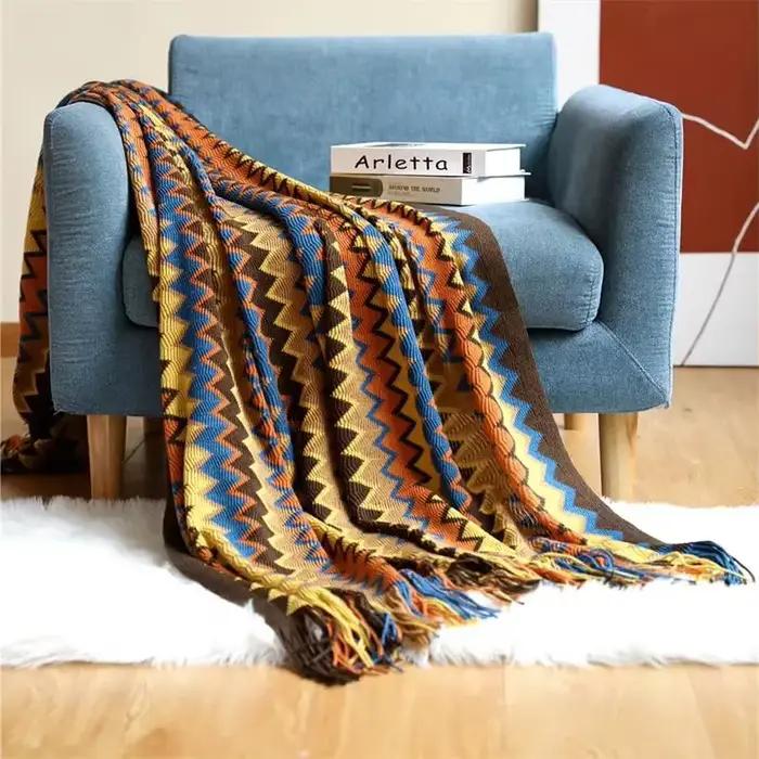 Couverture tricotée à la main avec pompons