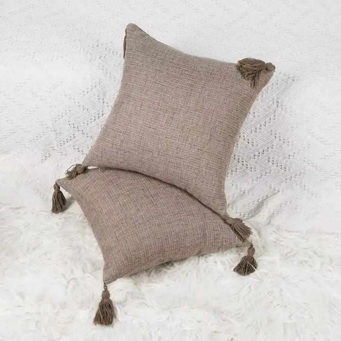 Juste de coussin avec pompon en lin